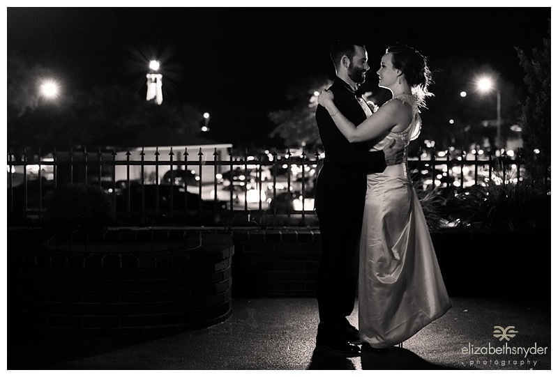 A bridal portrait at night on a rooftop patio.